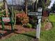 Community sign at Fairway Ct. surrounded by lush landscaping at 6001 Country Club Dr, Lake Wales, FL 33898