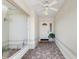 Welcoming home entryway featuring tile flooring, a ceiling fan, and a charming front door at 627 Watercrest Dr, Haines City, FL 33844