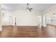 Large open living area showcasing wood flooring, neutral walls, and access to other rooms at 627 Watercrest Dr, Haines City, FL 33844