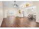 Spacious living room with hardwood floors, high ceilings, and a view of the dining area at 627 Watercrest Dr, Haines City, FL 33844