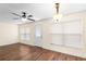 Inviting living room with two windows allowing ample light and a ceiling fan at 627 Watercrest Dr, Haines City, FL 33844