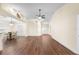 Bright, open-plan living room with hardwood floors, high ceilings, and a ceiling fan at 627 Watercrest Dr, Haines City, FL 33844