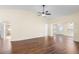 Spacious main bedroom with wood flooring, ceiling fan, and sliding mirror door to bathroom at 627 Watercrest Dr, Haines City, FL 33844