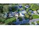 Aerial view of homes with pools, fenced yards, and well-kept lawns at 672 Wakulla Dr, Winter Haven, FL 33884