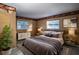 Cozy bedroom showcasing a comfortable bed, dresser, and natural lighting at 672 Wakulla Dr, Winter Haven, FL 33884