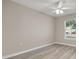 Bright bedroom featuring updated flooring, ceiling fan and natural light at 221 Avenue P Nw, Winter Haven, FL 33881