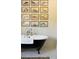 Elegant black and white clawfoot tub set against a gallery wall at 2300 Scenic N Hwy # 51, Lake Wales, FL 33898