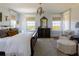 Bedroom featuring natural lighting, refined finishes, a dark wood chest, and an area rug at 2300 Scenic N Hwy # 51, Lake Wales, FL 33898