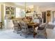 Cozy dining area with a wooden table, wicker chairs, and built-in display cabinets at 2300 Scenic N Hwy # 51, Lake Wales, FL 33898