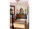 Bright foyer with a wood floor, chandelier, antique mirror, and decorative console table at 2300 Scenic N Hwy # 51, Lake Wales, FL 33898