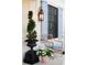Charming front porch with a wicker chair, garden container, and classic outdoor lantern at 2300 Scenic N Hwy # 51, Lake Wales, FL 33898