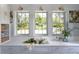Kitchen sink area featuring natural light from the windows, a floral design, and built-in shelving at 2300 Scenic N Hwy # 51, Lake Wales, FL 33898