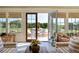 Open living room with access to an outdoor patio, large windows, and comfortable seating at 2300 Scenic N Hwy # 51, Lake Wales, FL 33898