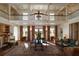 Grand living room featuring a soaring ceiling, Juliet balcony, and ornate area rug at 2300 Scenic N Hwy # 51, Lake Wales, FL 33898