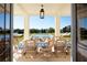 Outdoor dining table overlooking a pristine pool and manicured lawn at 2300 Scenic N Hwy # 51, Lake Wales, FL 33898