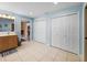 Spacious bathroom with tiled floor, closet, and a large vanity with a mirror at 4189 Limerick Dr, Lake Wales, FL 33859