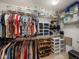 Organized walk-in closet with shelves, clothes racks, and storage bins at 4189 Limerick Dr, Lake Wales, FL 33859