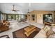 Airy Florida room featuring several seating areas, tile floors, and lots of natural light at 4189 Limerick Dr, Lake Wales, FL 33859