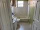Cozy bathroom with a tub, toilet, sink and vanity at 123 Osprey Heights Dr, Winter Haven, FL 33880