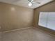 Neutral bedroom with a window and a ceiling fan at 123 Osprey Heights Dr, Winter Haven, FL 33880