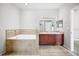 Bright bathroom with a tub and a double sink vanity at 2821 Sheldon St, Lakeland, FL 33813