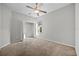 Bedroom with carpet, closet, and view of backyard through window at 2821 Sheldon St, Lakeland, FL 33813