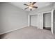 Bedroom with carpet floors, ceiling fan, and a closet with a folding door at 2821 Sheldon St, Lakeland, FL 33813