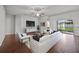 Bright living room with wood floors, modern furnishings, and sliding glass doors to the outdoor area at 2821 Sheldon St, Lakeland, FL 33813