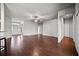 Open-concept living area with hardwood floors, modern ceiling fan, and abundant natural light at 2821 Sheldon St, Lakeland, FL 33813