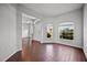 Bright living room with dark wood floors, large windows, and a neutral color palette at 2821 Sheldon St, Lakeland, FL 33813