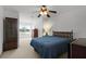 Bedroom with a bed, a dresser, and a window overlooking the beautiful backyard at 4071 Albritton Rd, St Cloud, FL 34772