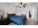 Bedroom with a bed, a dresser, and a window overlooking the beautiful backyard at 4071 Albritton Rd, St Cloud, FL 34772