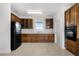 Kitchen featuring wooden cabinets and tile flooring at 4071 Albritton Rd, St Cloud, FL 34772