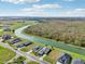 Aerial view of a waterfront community with luxury homes and lush landscaping at 473 Adams View Ln, Auburndale, FL 33823