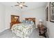 Bedroom with wood furniture, ceiling fan, and window coverings at 473 Adams View Ln, Auburndale, FL 33823