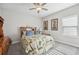 Bright bedroom featuring a comfortable bed and ceiling fan at 473 Adams View Ln, Auburndale, FL 33823