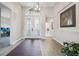 Elegant entryway with hardwood floors and chandelier at 473 Adams View Ln, Auburndale, FL 33823