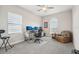 Bright home office with built-in desk and comfortable chair at 473 Adams View Ln, Auburndale, FL 33823