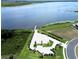 Aerial view of a lakefront property with boat ramp and parking at 473 Adams View Ln, Auburndale, FL 33823