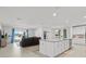 Open-concept living room and kitchen with a large island and stainless steel appliances at 912 Scrub Oak Hammock Rd, Davenport, FL 33837