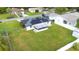 Home's backyard features a large lawn and solar panels at 105 Elliott Ln, Winter Haven, FL 33884