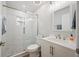 Bright bathroom featuring a glass shower door, modern vanity and brushed nickel plumbing at 105 Elliott Ln, Winter Haven, FL 33884