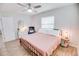 Serene bedroom featuring a cozy bed, decorative accents, and bright natural lighting at 105 Elliott Ln, Winter Haven, FL 33884