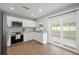 Well-lit kitchen featuring stainless steel appliances, ample cabinet space and sliding glass doors at 105 Elliott Ln, Winter Haven, FL 33884