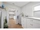 Bright Laundry room with granite counters and window at 105 Elliott Ln, Winter Haven, FL 33884