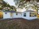 View of the back of the house and yard at 2002 Sutton Rd, Lakeland, FL 33810