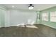 Inviting bedroom featuring recessed lighting, wood-look floors, and natural light from two windows at 2002 Sutton Rd, Lakeland, FL 33810