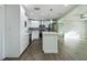 Well-lit kitchen features stainless steel appliances, quartz countertops, and a tiled backsplash at 2002 Sutton Rd, Lakeland, FL 33810