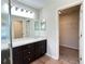 Bright bathroom with a double vanity and a walk-in closet at 222 Cattail Way, Lake Alfred, FL 33850