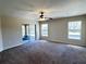 Bright living room with sliding glass doors leading to the outdoor patio at 222 Cattail Way, Lake Alfred, FL 33850